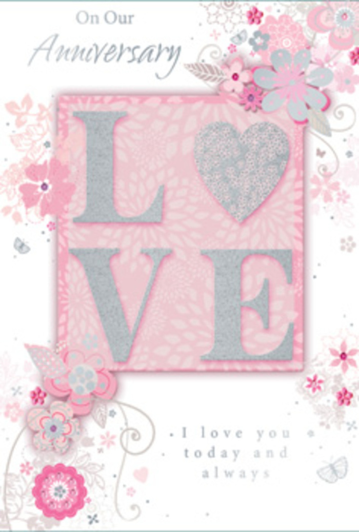 An open view of this anniversary card reveals a design that feels quietly luminous, as if lit by soft afternoon light filtering through a Surrey cottage window. The word LOVE sits as the central motif, printed in bold capitals that are raised above the surface and finished with a frosted layer of glitter. This glitter gives the letters a gently sparkling edge and a noticeable grain under the fingertips, inviting a moment of tactile exploration. Behind them lies a blush-pink band, slightly framed, that helps the word stand out against the surrounding pastel background. Around the central text, wispy, hand-drawn blooms drift along the borders and into the corners, their petals tinted in shades of blush, lilac-tinged pink, ivory, and soft grey. The lines are fine and somewhat sketch-like, echoing the way a florist might first outline an arrangement on paper before gathering roses, lisianthus, and foliage for a real anniversary bouquet. Dainty leaves, slender scrolls, and almost-hidden butterflies weave in and out of the floral sprays, giving the impression of gentle movement and the quiet flutter of excitement that an anniversary can bring. The typography of the accompanying message-phrases including I love you today and always-is understated yet graceful, written in a light, looping script that feels both personal and timeless. The overall composition is balanced and open, with plenty of breathing space so each decorative element can be appreciated, much like a thoughtfully spaced bouquet on a dining table in Reigate or Esher. It conveys gratitude, hope, and enduring affection in a way that pairs naturally with fresh anniversary flowers delivered across Surrey.